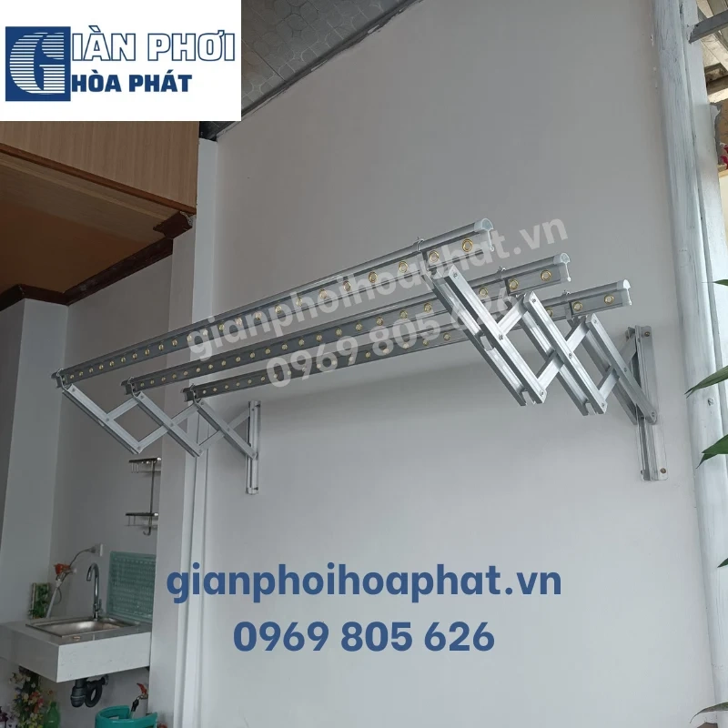 A metal rack on a wallDescription automatically generated